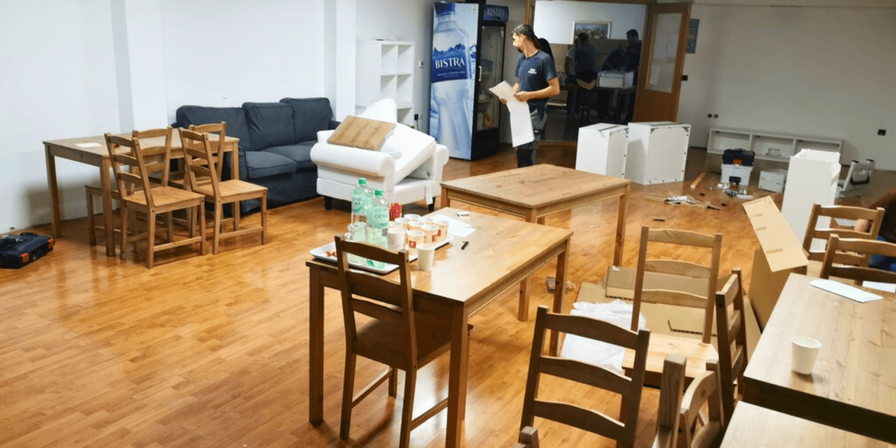 Volunteers setting up furniture donated by IKEA for refugee housing