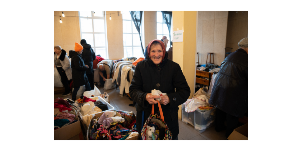 woman receiving donated clothes