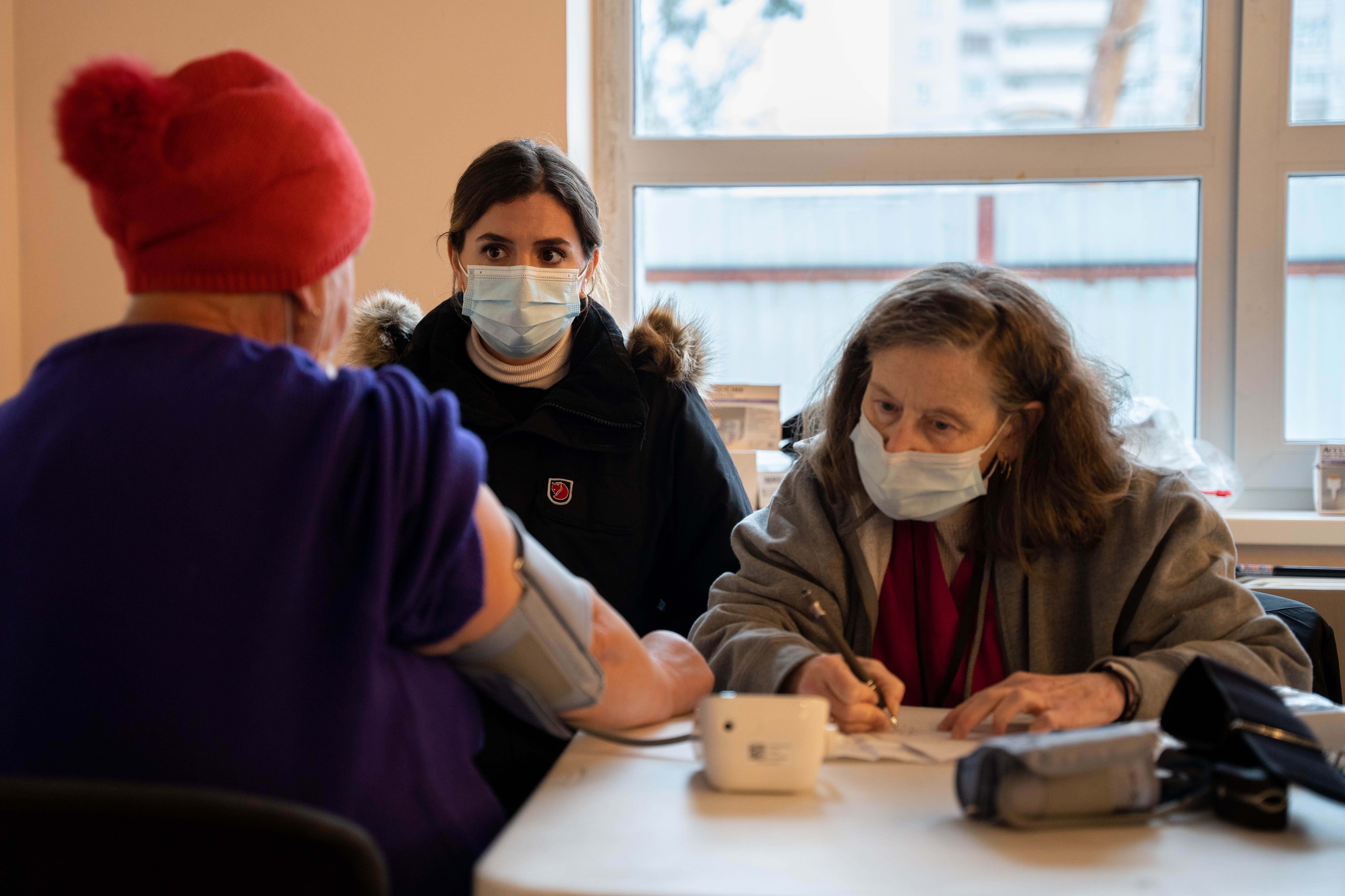 A medical team assesses a patient