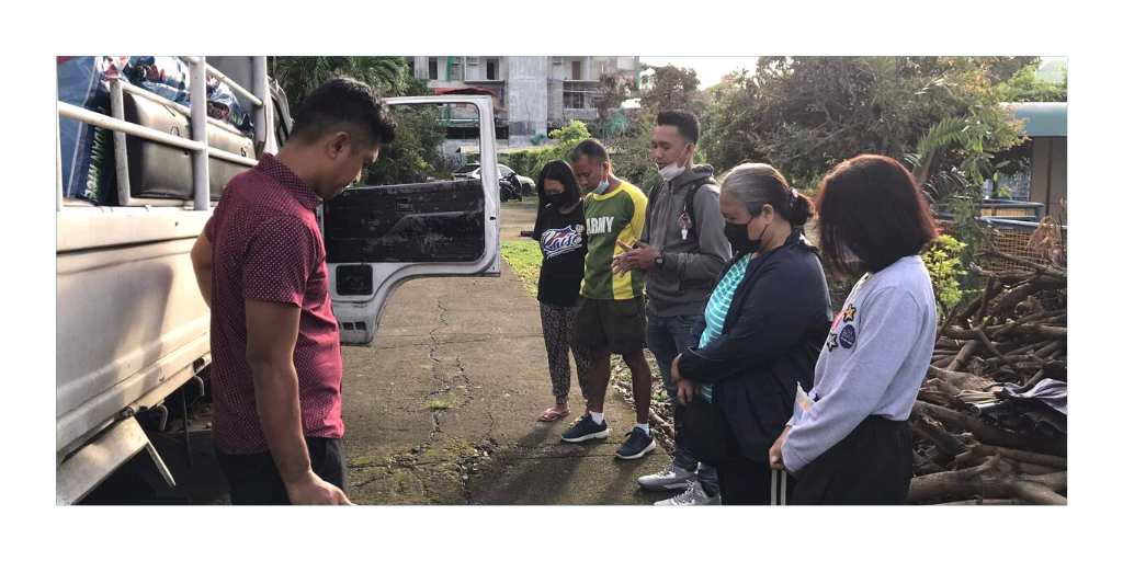 Praying before distributing aid