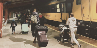 people moving through train station in Poland