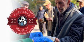 Christmas Project Seal and man receiving food
